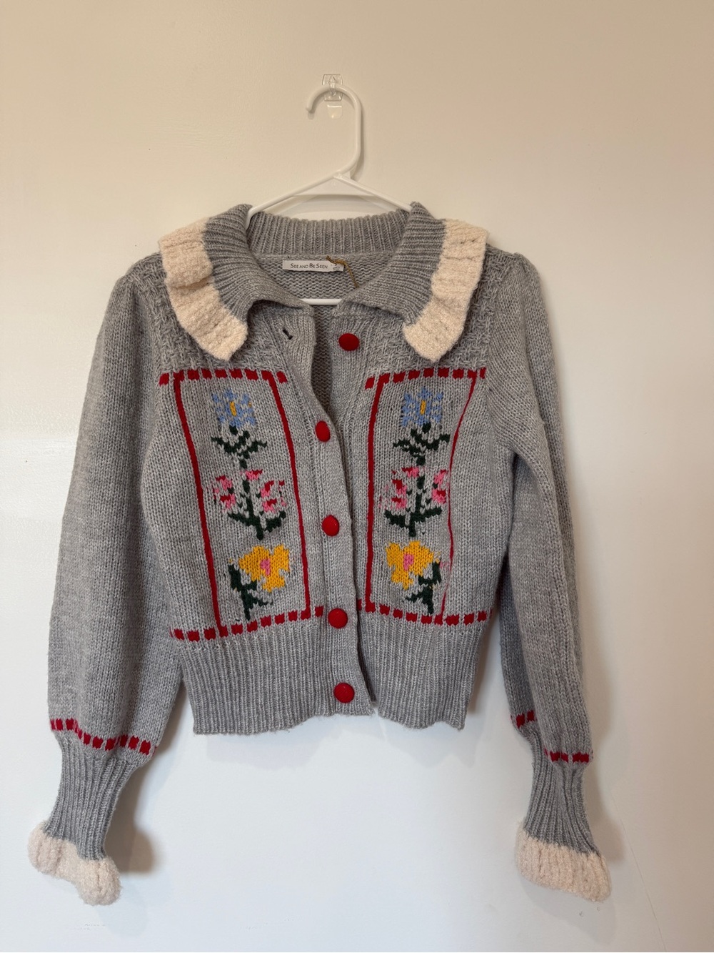 Grey Floral Knit Cardigan with Cream Ruffle Collar and Red Accents